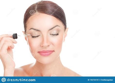 Woman Applying Serum Essence Essential Oils To Her Eyelashes Stock