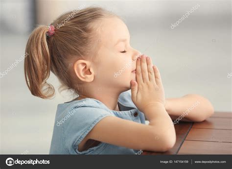 Little Girl Praying — Stock Photo © Belchonock 147154159