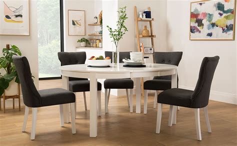 Extending round room kitchen and dining tables are a great option for both modern and traditional style kitchens. Marlborough Round White Extending Dining Table with 4 ...