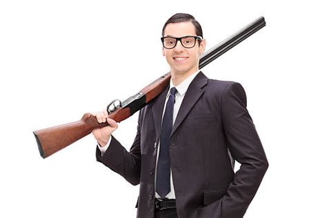 Man Holding Shotgun Stock Photos Pictures And Royalty Free Images Istock