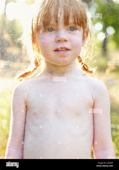 Portrait Of Shirtless Girl Sprinkled With Water Stock Photo Alamy
