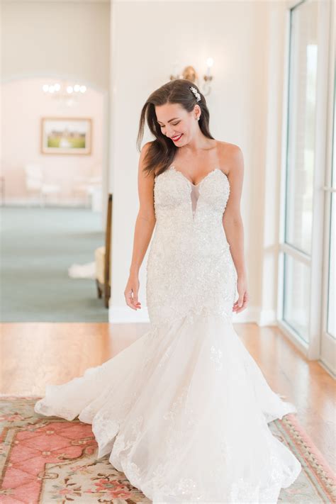 strapless beaded lace and tulle fit and flare wedding gown with illusion plunge in bodice