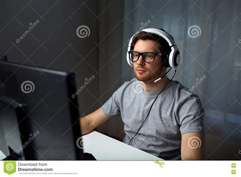 Man In Headset Playing Computer Video Game At Home Stock Photo Image