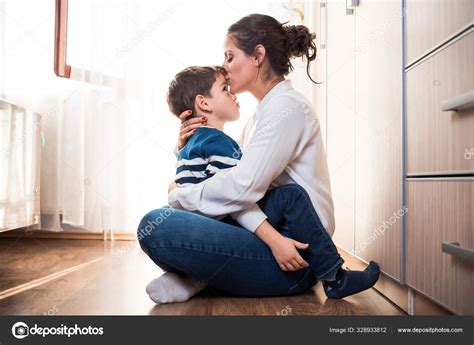 Beautiful Mom And Her Son On The Floor Being Affectionate With Each