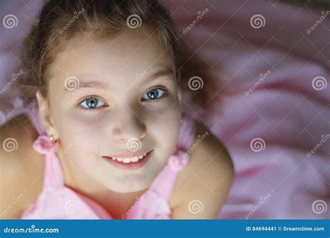 Close Up Portrait Of Beautiful Teen Girl In Pink Dress Enthusiastically
