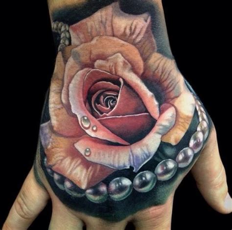 It is a tattoo of a yellow rose. Best 66 Hand Tattoos