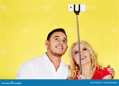 Happy Couple Taking Selfie Photo With Selfie Stick Stock Photo Image
