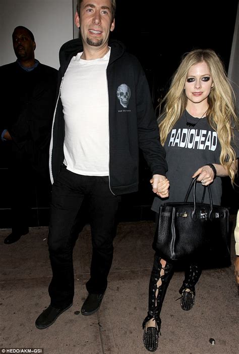 Avril Lavigne Sports Heavy Panda Eyes And Lace Up Leather Trousers For