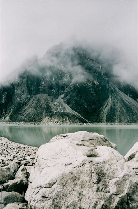 Turquoise Lake And Himalayan Mountain Surrounded By Fog Shot On Film