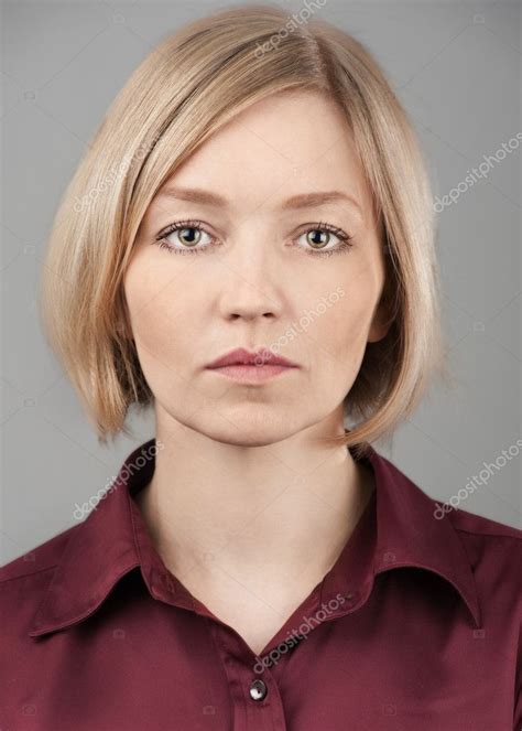Portrait Of Pretty Blond Woman With Serious Face Stock Photo By