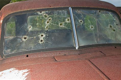 Bullet Hole In Car Window Stock Photos Pictures And Royalty Free Images