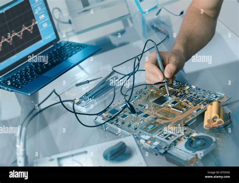 Electronics Repair Background Hand Of Male Tech Testing Motherboard
