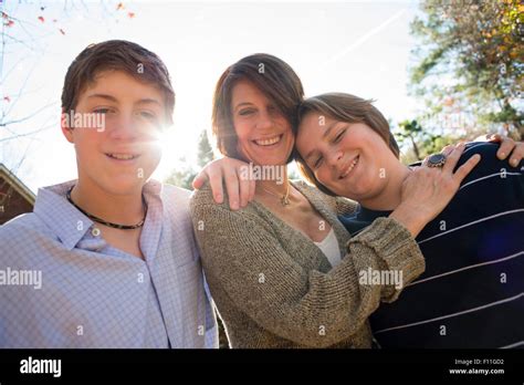 Caucasian Mother And Sons Hugging Outdoors Stock Photo Alamy