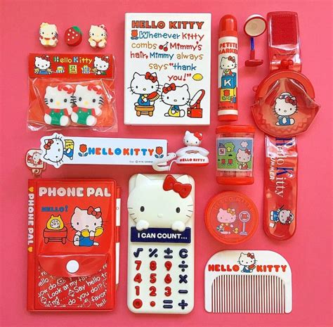 Hello Kitty Items Laid Out On A Pink Surface