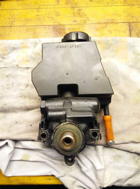 The location of the reservoir differs. OEM Power Steering Pump & Reservoir - LS1TECH