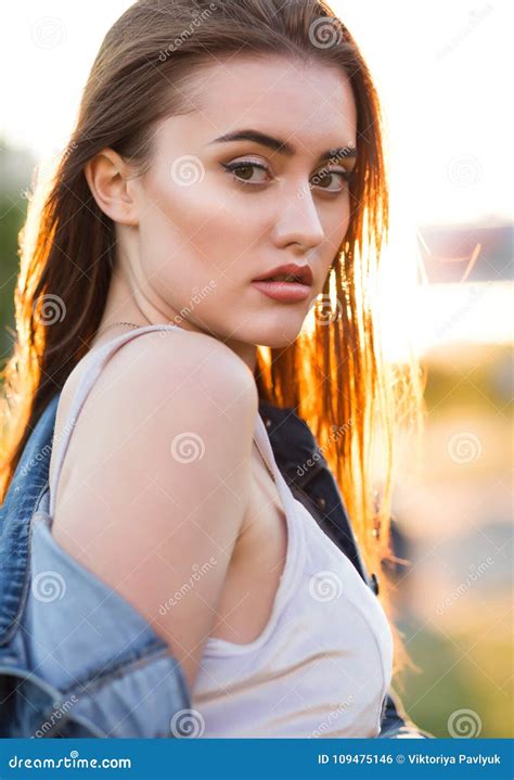 Seductive Brunette Woman With Perfect Skin Posing In Rays Of Sun Stock