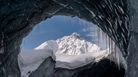 Download Wallpaper 1366x768 Cave Glacier Snow Mountain Tablet