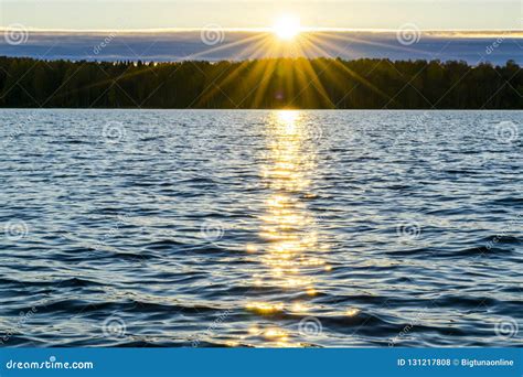 Water Surface View Of A Sunset Sky Background Dramatic Gold Sunset
