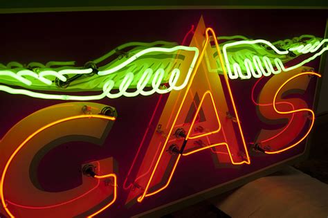 Porcelain And Neon Signs By Vault Vault Custom Garage Design