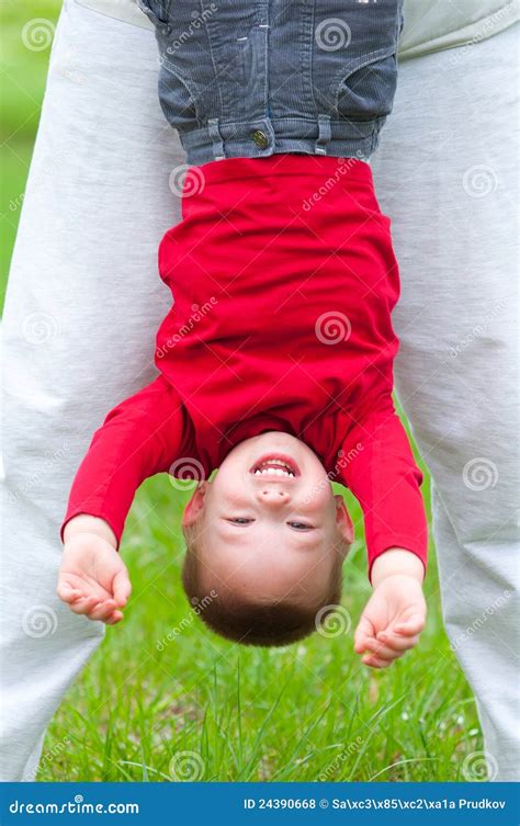 Happy Little Boy Hanging Upside Down On Meadow Stock Photo Image Of