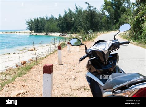 Black Modern Motorcycle Standing On Sea Shore On The Way To Hai Van