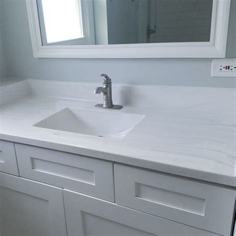 A cultured marble vanity top includes an integral sink that comes attached to the counter itself. Affordable countertops for extra bathrooms - Carrera Frost ...