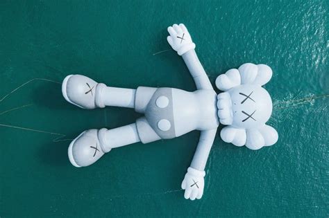 Kaws Takes His Holiday Inflatable Sculpture To Something In The Water