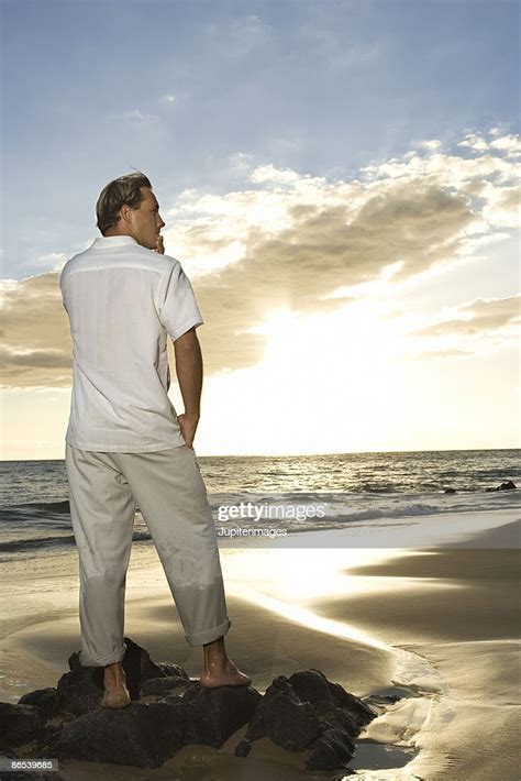 Man Standing On Beach High Res Stock Photo Getty Images