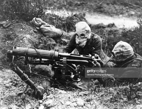 Gas Masked Men Of The British Machine Gun Corps With A Vickers