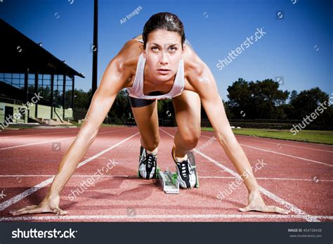 Portrait Female Athlete Starting Blocks Stock Photo 404728438