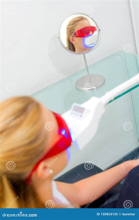 lady having dental treatment wearing protective glasses stock image image of equipment