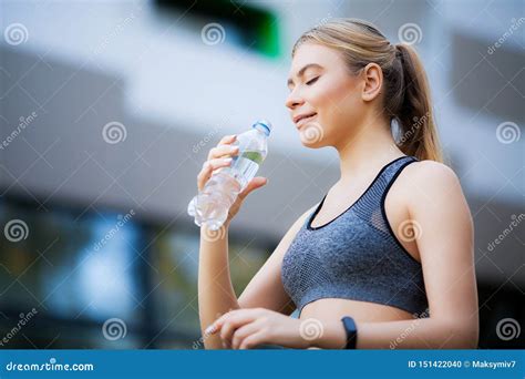 Fitness Women Woman Drinking Water From Bottle In Nature Stock Photo