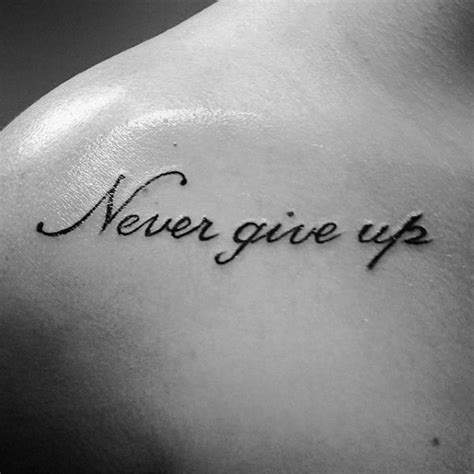 You will carry the best inspiration for you on your body forever. 60 Never Give Up Tattoos For Men - Phrase Design Ideas
