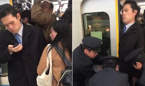 Commuter Is Squashed Into A Packed Tokyo Subway Train Daily Mail Online