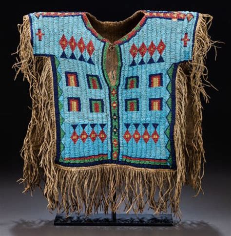 A Rare Sioux Boys Pictorial Beaded And Fringed Hide Shirt Is Highlight