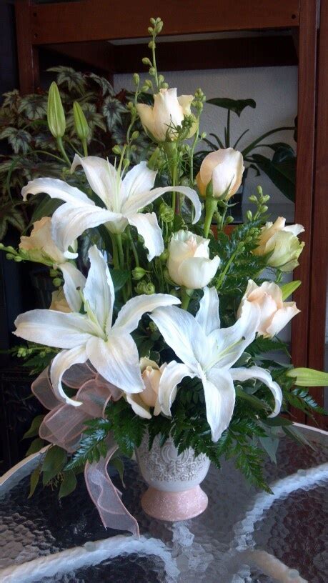 Formal Arrangement With White Casablanca Lillys And Peach Roses