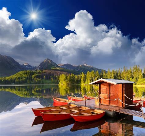 Premium Photo Beautiful Red Boat In A Mountain Lake Strbske Pleso