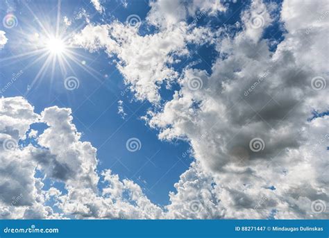 Cloudy Blue Sky As Background Direct Sunlight Sun Above The Clouds