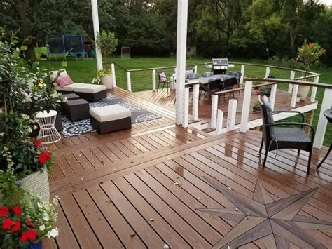 A man smiles while building his backyard deck. New Roof over Deck - DoItYourself.com Community Forums