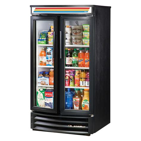 One in front of refrigerator w/ice and water dispenser, stove, and patio door. Glass Front Refrigerator for Home - HomesFeed