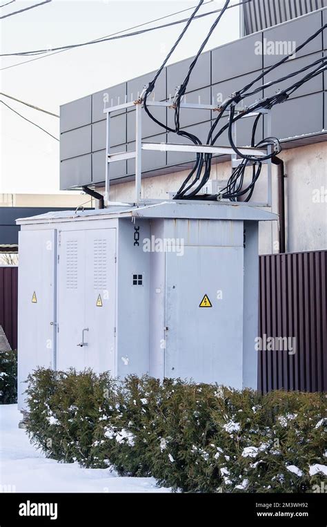 Electric Substation Near A Private House Gray Transformer Booth On The