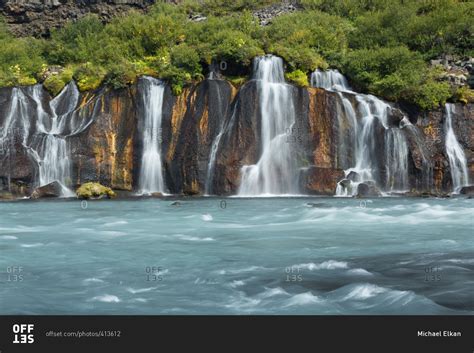Icelandic Waterfalls Falling Into Fast Flowing Glacial River Stock
