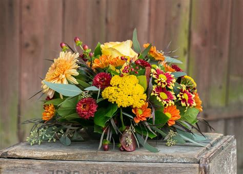 Harvest In November A Low Round Centerpiece Featuring Burgundy And