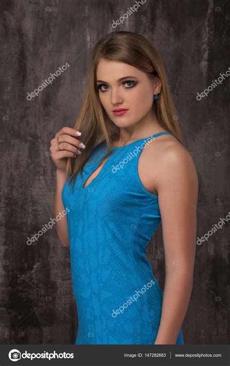 Beautiful Happy Young Woman In Blue Dress On Grey Background Stock