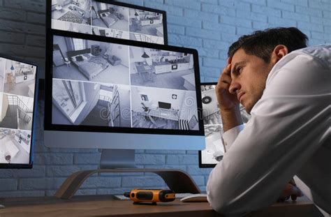 Male Security Guard Monitoring Cameras Stock Photo Image Of Control