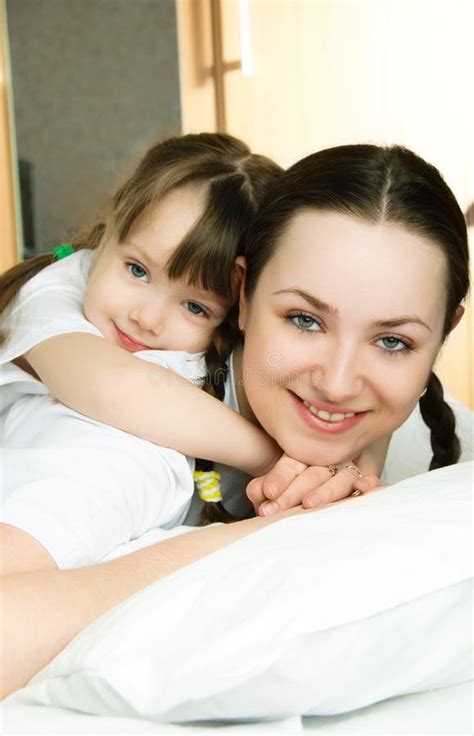 Mother And Daughter On The Bed Picture Image 8497675