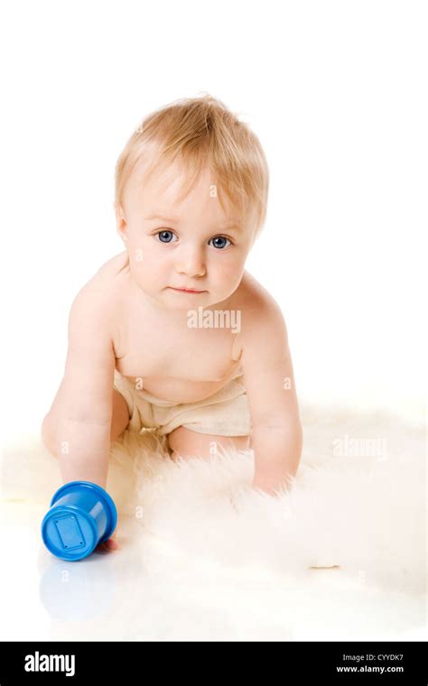 Curious Baby Playing On Fur Looking Up Isolated On White Stock Photo
