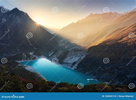 Mountain Valley And Lake With Turquoise Water At Sunrise In Nepa Stock
