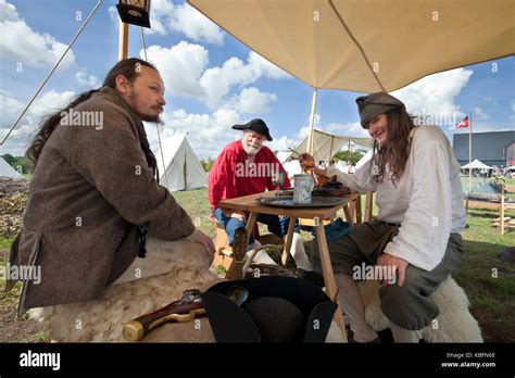 A Group Of Men 18th Century Smugglers Sitting Around A Table At