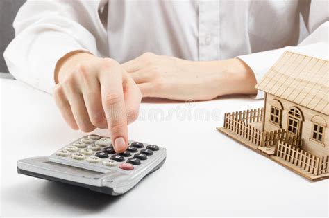 Real Estate Concept Businessman Counting Behind Home Architectural